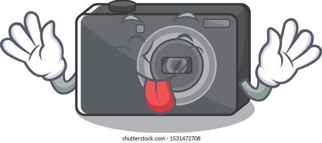 Tongue out digital camera on a cartoon table
