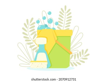 Tools for cleaning the house on the background of leaves and plants.