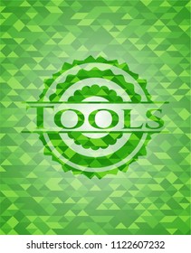 Tools green emblem. Mosaic background