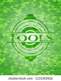 Tools green emblem. Mosaic background