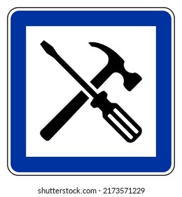 Tools and road sign on white