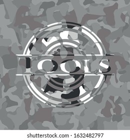 Tools written on a grey camouflage texture