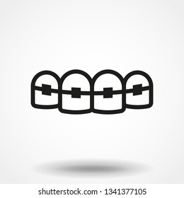 Tooth with braces vector icon.