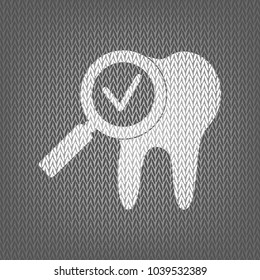 Tooth icon with arrow sign. Vector. White knitted icon on gray knitted background. Isolated.