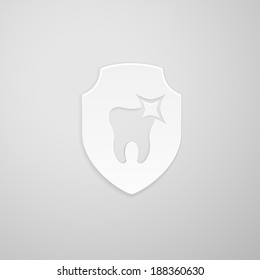 Tooth icon in the form of a shield on gray background