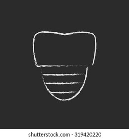 Tooth implant hand drawn in chalk on a blackboard vector white icon isolated on a black background.