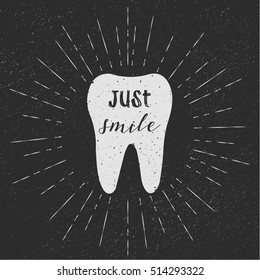 Tooth. Just smile. Vector. White tooth on black background. Vintage retro sunburst, grunge background. Typography text on tooth. Hipster style. Fabric print, t-shirt print, logo design, eps10.