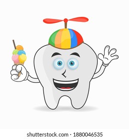 Tooth mascot character with Tooth and colorful hat. vector illustration