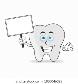 Tooth mascot character holding a white blackboard. vector illustration