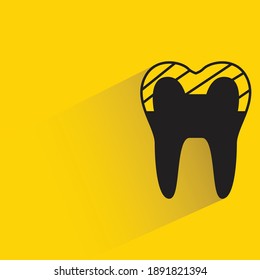 tooth with shadow on yellow background vector