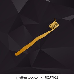 Toothbrush with applied toothpaste portion. Golden style on background with polygons.