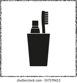 Toothbrush with toothpaste  - black vector icon