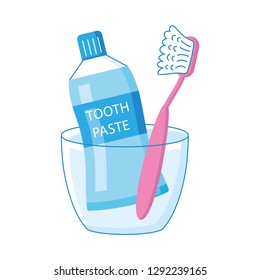 Toothbrush and toothpaste in a cup isolated