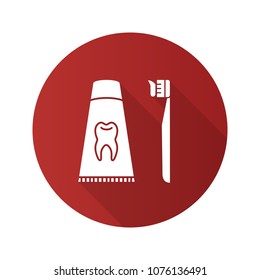 Toothbrush with toothpaste flat design long shadow glyph icon. Dentifrice. Vector silhouette illustration