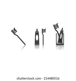 Toothbrush toothpaste and glass
