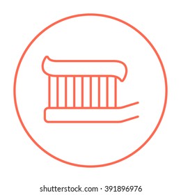 Toothbrush with toothpaste line icon.