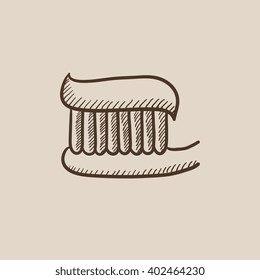 Pincel de dientes con icono de dibujo de pasta dental.
