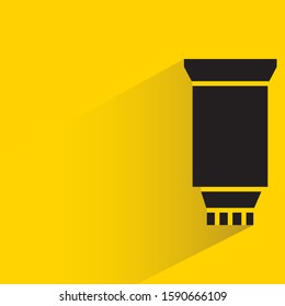 toothpaste, dentifrice with drop shadow in yellow background