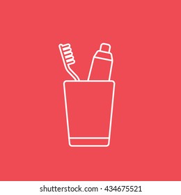 Toothpaste and Tooth Brush In Cup Line Icon On Red Background