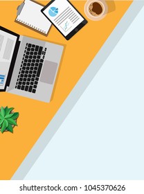 Top aerial View of business desk table with laptop,business paper work,a cup of coffee, notebook,tablet,small table tree with copy space for text in vertical portion view