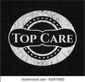 Top Care chalk emblem written on a blackboard