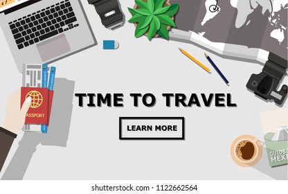 Top down flat lay view of table with laptop, camera,lens,mobile phone,a cup of coffee,travel book,hand holding passport and plane ticket,world map,tree and copy space for text"Time to Travel"