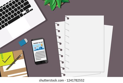Top down flat view of table  with laptop, mobilephone, credit card,tablet,watch, pencil,rubble and copy space for text