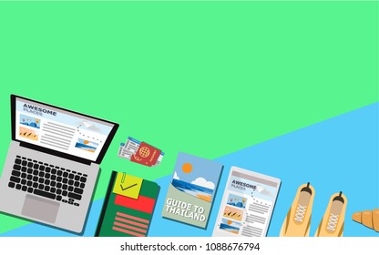Top Down view of laptop,travel book,tablet,notebook,passport with plane ticket,sport shoes,croissant with copy space for your text on pastel color of blue with green for wallpaper,background,backdrop