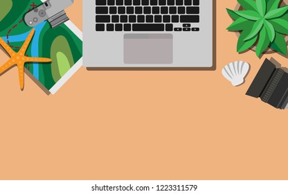 Top down view of working table desk with laptop,map,camera and copyspace for your text
