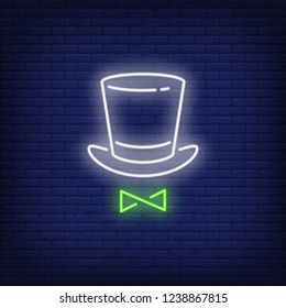 Top hat and bow tie neon sign. Performance or advertisement design. Night bright neon sign, colorful billboard, light banner. Vector illustration in neon style.