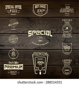 Top quality badges logos and labels for any use. Company corporate logo element design. On wooden background texture