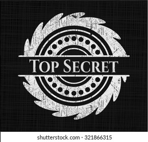 Top Secret chalk emblem written on a blackboard