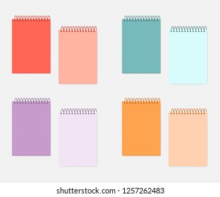 Top spiral A4 notebook with colored cover and sheets, mockup set. Wire bound blank multicolored notepads, mock-up. Sketchbook or diary, vector template.