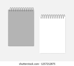 Top spiral A4 notebook, realistic mockup. Wire bound blank notepad: gray cover and white page, mock-up. Sketchbook or diary, vector template.