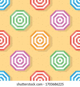 Top veiw of umbrella seamless pattern background. Colorful umbrella on sand beach. Hexagon repeat background.