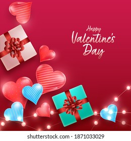 Top View Of 3D Gift Boxes With Glossy Hearts And Lighting Garlands Decorated On Red Background For Happy Valentine's Day.