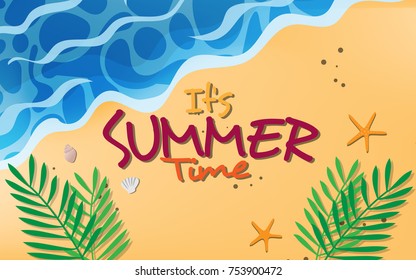 Top view above the sand beach with sea, waves, star fish, sea shell, coconut leaves and with text in the copy space "It's Summer Time"