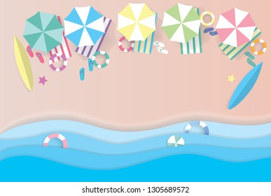 top view beach background with umbrellas balls swim ring surfboard sandals starfish and sea , aerial view of summer beach in paper craft style.paper cut and craft style