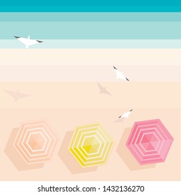 Top view beach background with umbrellas, seagulls and sea. Sunny day. Summer time