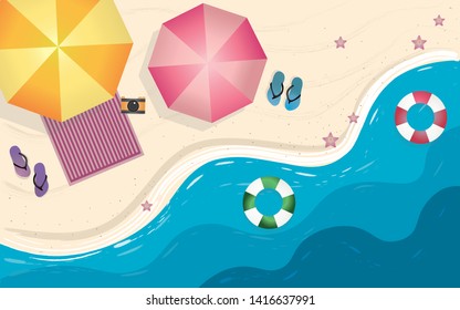 top view beach background with umbrellas,swim ring,sandals,starfish and sea. aerial view of summer beach.