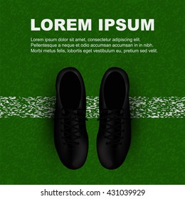 top view of black soccer shoes at line of field with copy space on top area of image for your design, adverting, banner, sport campaign,