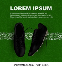 top view of black soccer shoes on the line on field with copy space on top area of image, this design use for banner, sport campaign, adverting, sport ticket 