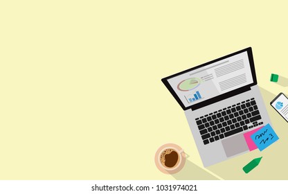 Top view of business desk with laptop with business info, a cup of coffee, note pad, mobile phone. All together with long shadow on the pastel yellow background with copy space for text