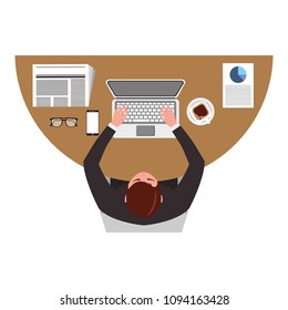 top view businessman typing in laptop with mobile papers and coffee cup