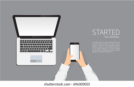 Top view Businessman's hands using smartphone , laptop and digital tablet on grey background.