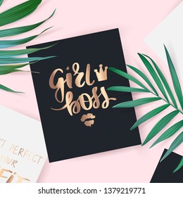 Top view with card. Girl Boss - Vector hand drawn lettering phrase. Motivation and inspiration gold quote. Flat lay with palm leaves