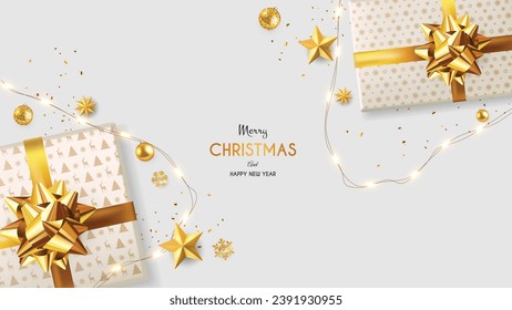 Top view Christmas Golden Decoration on gray Table. Golden balls, stars, and gift box with golden ribbon.