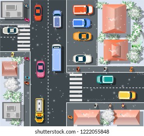 Top view Christmas New Year snow winter holiday from above on a city street speed highway with cars and buses, trees and trucks