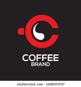 Una vista superior del logo de la taza de café sobre fondo negro
