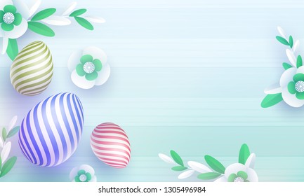 Top view of colorful easter eggs and paper cut flowers on blue stripe background.